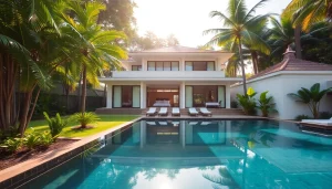 Real estate agent Phuket showcasing a stunning luxury villa with a private pool amidst tropical plants.